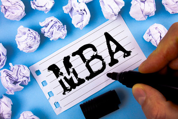 Wall Mural - Word writing text Mba. Business concept for Master of Business Administration Advance Degree After College Studies written by Man Notepad paper plain blue background Paper Balls next to it.