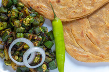 Lachha Paratha, Whole Wheat Layered Flat Bread With Masala Bhindi (Lady Finger) Sabzi Or Bhaji Or Recipe.