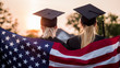 © StockMediaProduction - Two college graduates in gowns and caps with the American flag