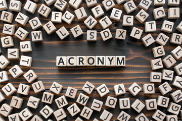 acronym - word from wooden blocks with letters, use of acronyms in the modern world abbreviation con