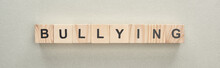 Panoramic Shot Of Wooden Blocks With Bullying Lettering On Grey Background