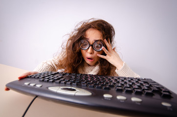funny nerd girl working on computer