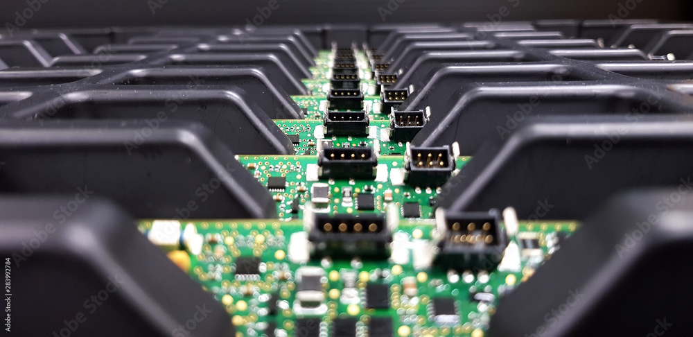 Electronics Manufacturing Services, Assembly Of Circuit Board arrangement, close-up of the raw of PCBA in tray. - obrazy, fototapety, plakaty 