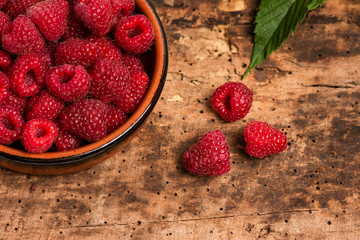 Bunch of fresh raspberries in a bowl