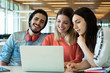 © Mego-studio - University students using laptop in university library.