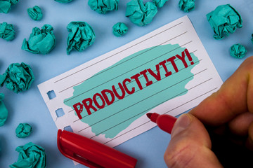 Text sign showing Productivity Motivational Call. Conceptual photo Effective work Great perfomance Success focus written by Man Painted Notepad Paper holding Marker plain background Paper Balls.