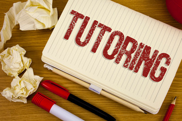 Poster - Conceptual hand writing showing Tutoring. Business photo showcasing Mentoring Teaching Instructing Preparing Supporting Give lessons written Notebook Book the wooden background Pen Pencil.
