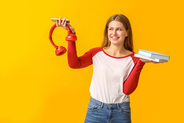 Sticker - Young woman with books, mobile phone and headphones on color background. Concept of choosing between reading and listening to audiobook