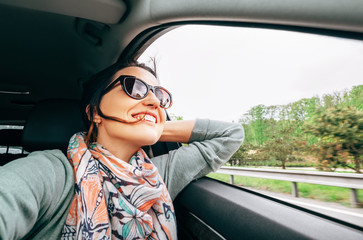 Wall Mural - Woman enjoy with view from car window when traveling by auto
