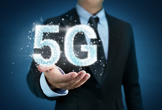 Business man holding 5G wifi technology concept