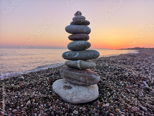 Fotomural stack of stones on the beach