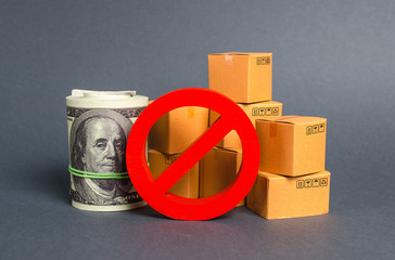 Wall Mural - The prohibition sign NO blocks a bundle of dollars money and cardboard boxes. Embargo, trade wars. Restriction on importation goods, proprietary for business. Sanctions and economic restrictions