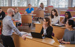 © Nejron Photo - Lecturer and multinational group of students in an auditorium