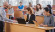 © Nejron Photo - Lecturer and multinational group of students in an auditorium