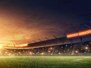 soccer stadium with illuminated tribunes. sports event. night dramatic sky.