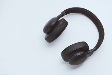 Black headphones on a white background. Music concept with copyspace. Headphones isolated