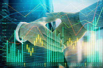 Double exposure of financial graph on cityscape background with two businessman handshake. Concept of stock market deal