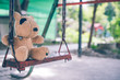 © bussapa - The brown dog doll is in the playground
