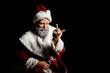 © Vladimir - Portrait of a bad brutal mature Santa Claus showing middle finger signs, isolated on black background