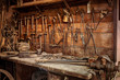 Complete workbench with a wall of tools in a workshop. Vintage look
