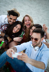 Portrait of group of young friends having a party