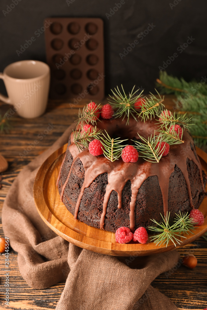 Tasty Christmas pie on wooden table