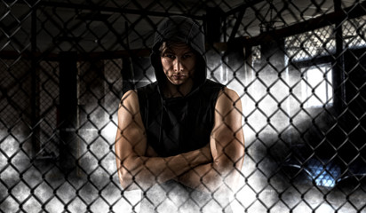 strong mixed martial arts fighter inside the cage