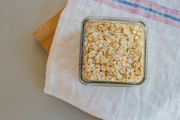 Raw oats with milk in the kitchen table