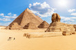 The Pyramids and the Sphinx in the sunny desert of Giza, Egypt