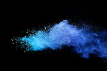 Blue Powder Explosion On Black Background. Colored Cloud. Colorful Dust Explode. Paint Holi.