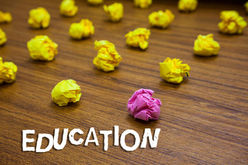Poster - Conceptual hand writing showing Education. Business photo showcasing receiving or giving systematic instruction especially school Lots crumpled papers mistakes not satisfied wooden floor