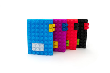 Poster - Creative building blocks toys notebooks isolated on white background