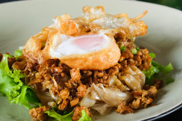 Thai tradition delicious food hot fried noodles with pork and fried egg