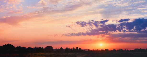 Wall Mural - light through the clouds against the backdrop of an exciting, vibrant sky at sunset. panorama, natur