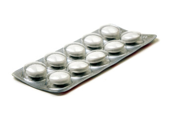 white tablets in a package isolated on a white background