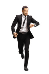 Poster - Young professional man in a suit running late