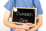 Fototapeta  - Doctor shows information on blackboard: outreach clinic.  Medical concept.