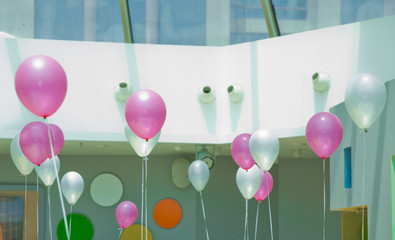 Balloons with happy celebration . Bunch of White and blue balloons. Concept of happiness, joy, Love, birthday, wedding. White and pink balloons flying in the sky .