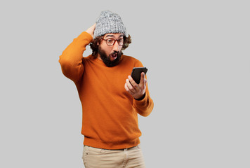 Wall Mural - young bearded man with a smart phone