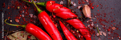 fresh-chili-pepper-on-dark-background-view-from-above