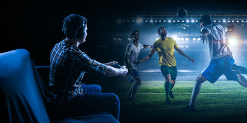 Wall Mural - Young man playing football video game