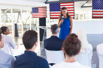 Wall Mural - Female speaker speaks in a business seminar