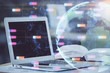 © peshkova - Double exposure of desktop with computer and world map hologram. International data network concept.