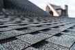 © LIGHTFIELD STUDIOS - selective focus of grey shingles on rooftop of building