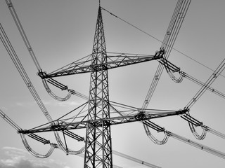 high voltage power lines on background of sky