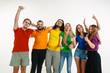 © master1305 - Young man and woman weared in LGBT flag colors on white background. Caucasian models in bright shirts. Look happy together, smiling, hugging. LGBT pride, human rights and choice concept. Celebrating.