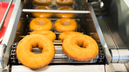 Wall Mural - Donuts being made