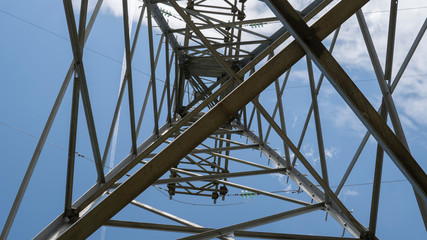 Electric tower on background clouds on blue sky