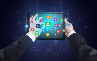 Poster - Hand using tablet with colorful bounce application symbols and icons concept