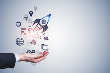 Poster - Man hand launching startup rocket